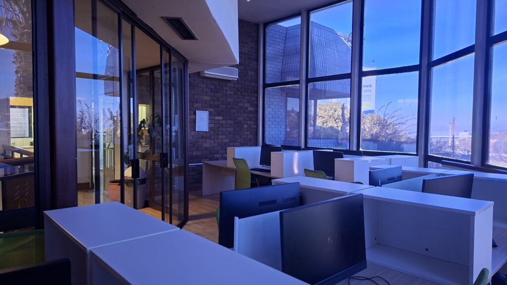 Work-space desks and glass partitions