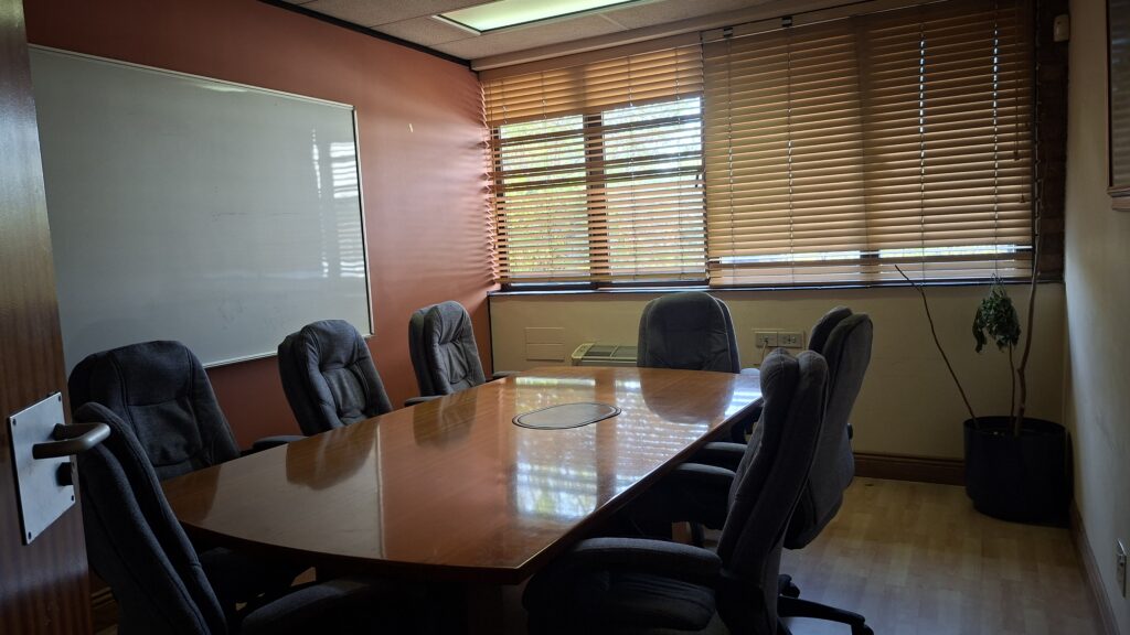 Meeting room with a conference table and whiteboard