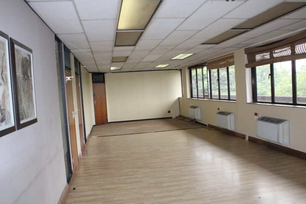 Empty office space with windows, ready to furnish